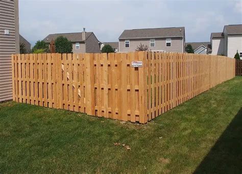 building a shadow box fence with round steel posts|installing shadow box fence panels.